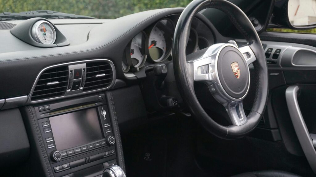A technician updates the car's navigation maps
